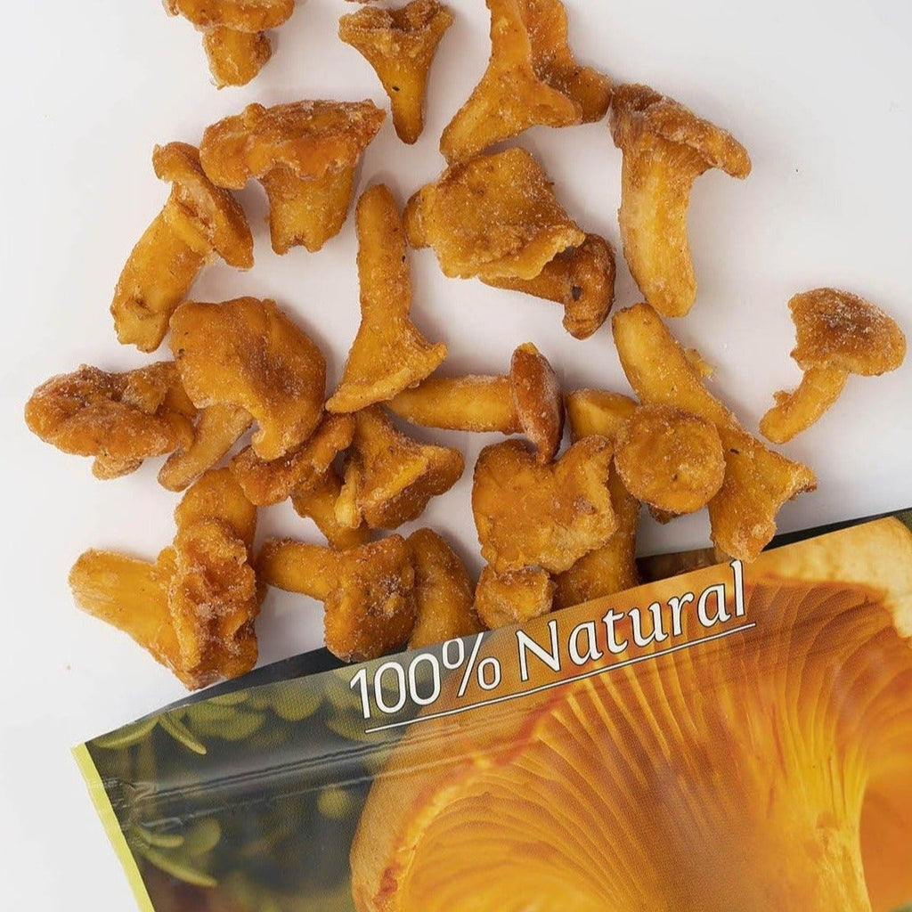 frozen golden-brown mushroom slices scattered above an open bag labeled '100% Natural' and 'Terarium'.